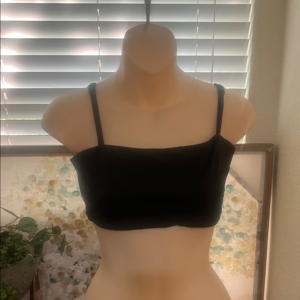 Gymshark Black Sports Bra. Slightly gathered in front w/ logo front lower left.